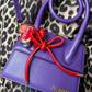 Charm para bolso con lazo